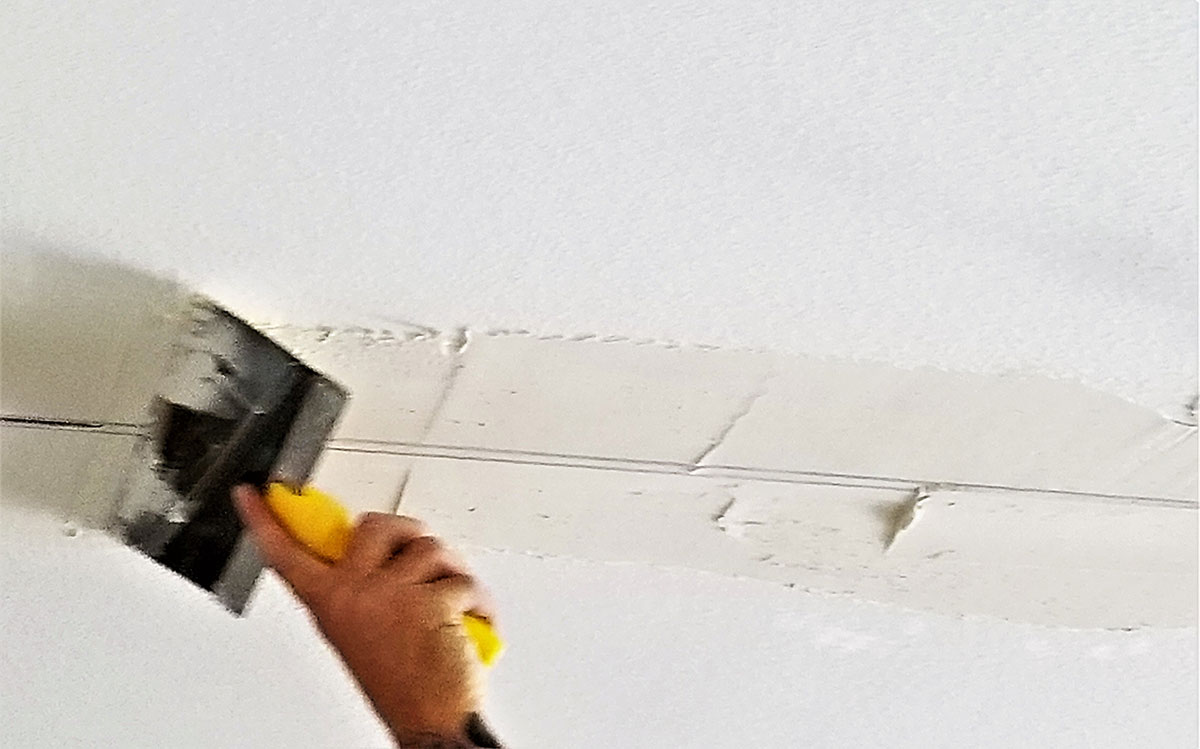 repairing a crack in the ceiling