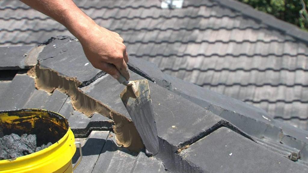 tradesperson repairing roof