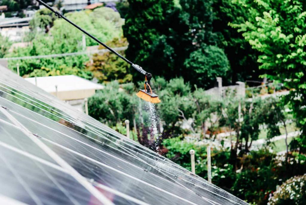 spraying distilled water on solar panels