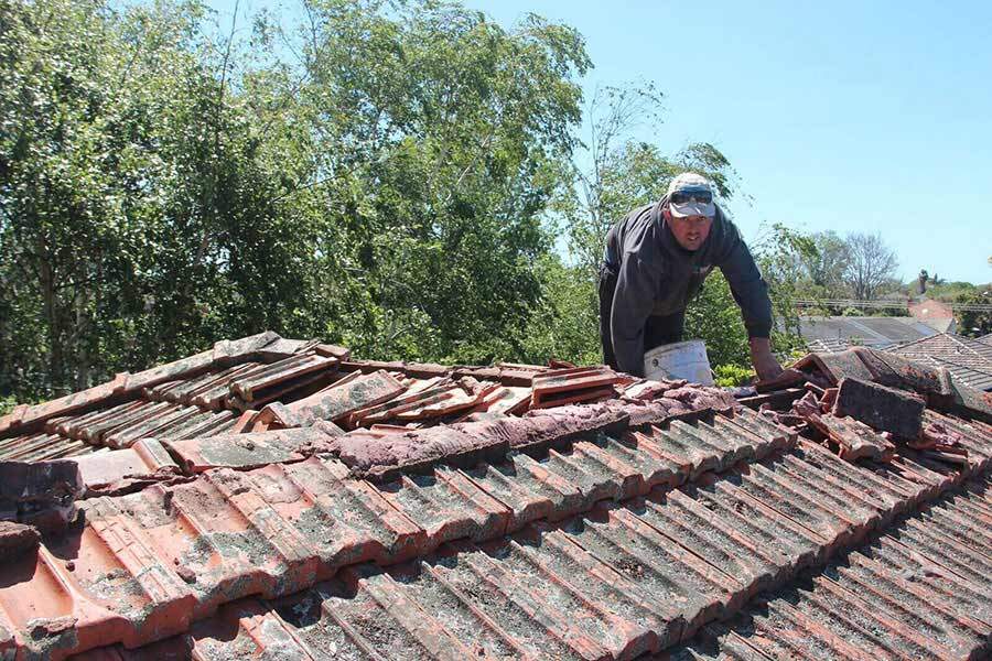 A terracotta tiled roof in Melbourne with severe damage