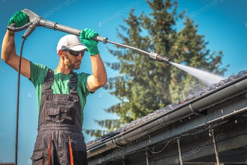 a man cleaning his roof