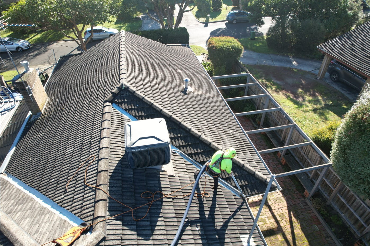 Original tile roof in Heathmont being checked for cracked tiles during a free roof condition report